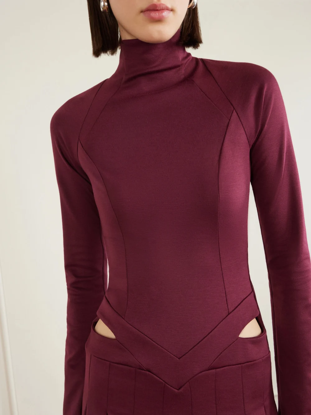 Close-up detail of the Tolu Coker Open-back Cutout Pleated Jersey Turtleneck Midi Dress