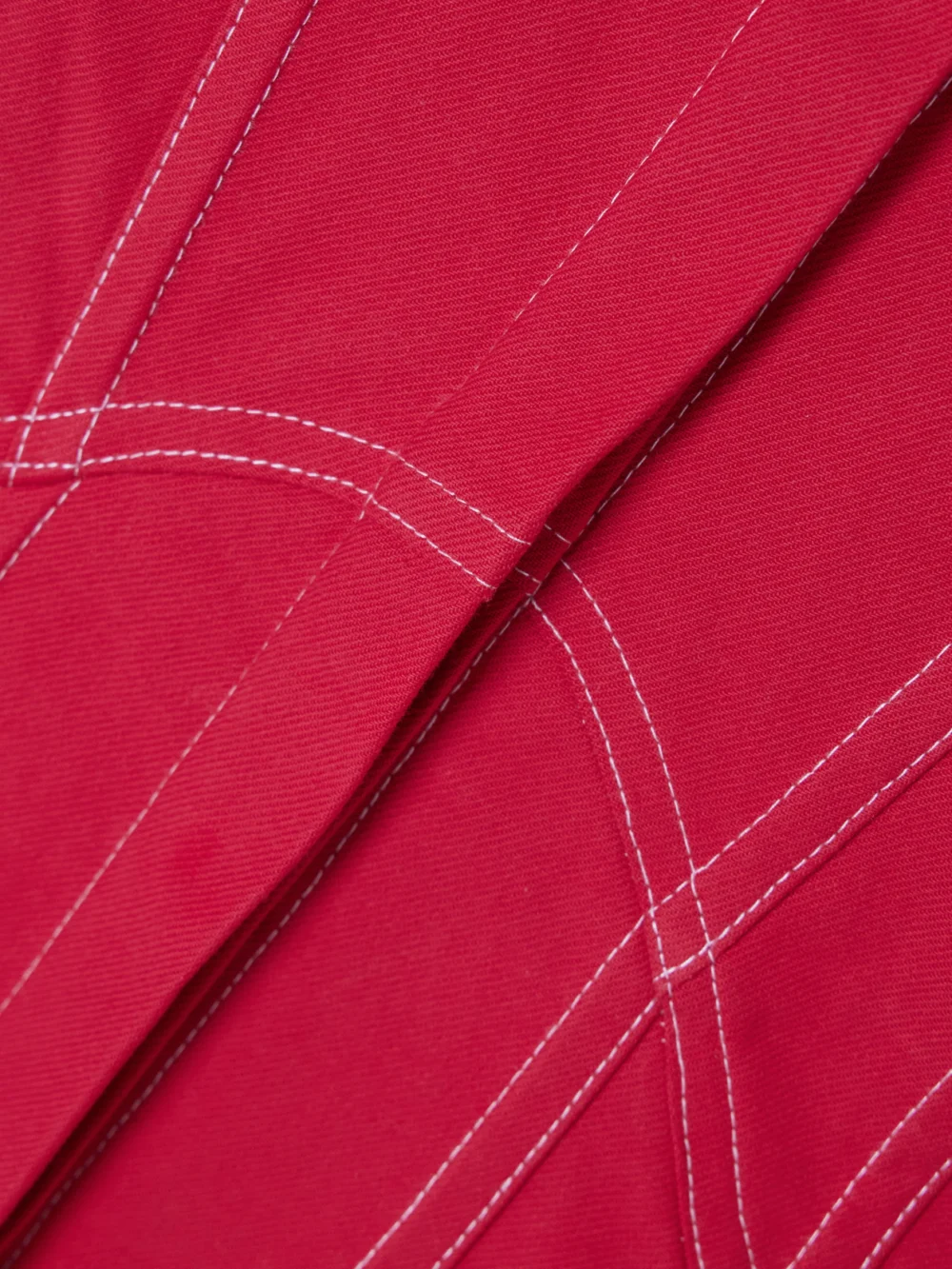 Close-up detail of the Tolu Coker Paneled Topstitched Denim Mini Shirt Dress