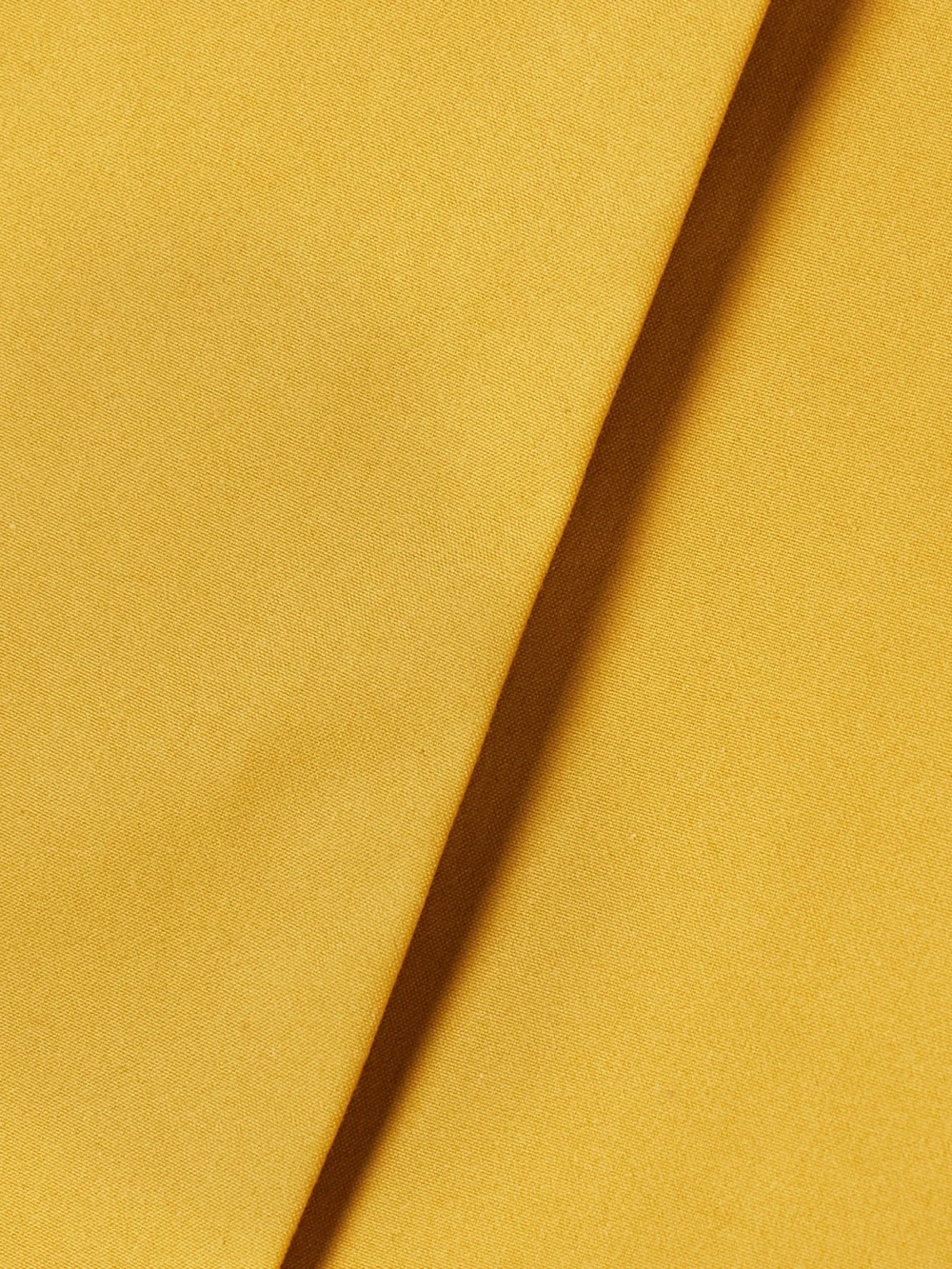 Close-up detail of the Tolu Coker Pleated Cotton-poplin Mini Wrap Skirt