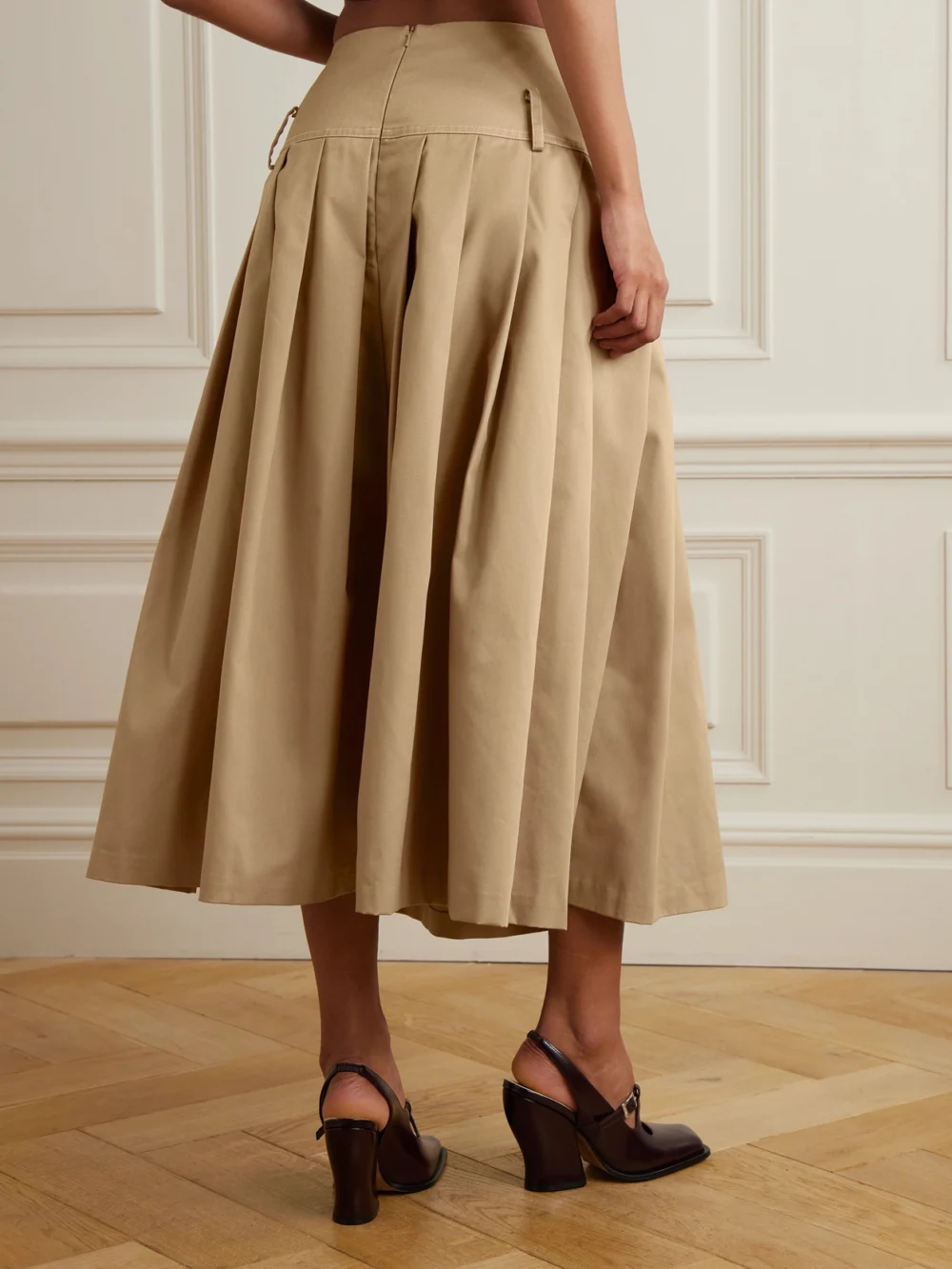 Back view of the Tolu Coker Pleated Topstitched Denim Midi Skirt