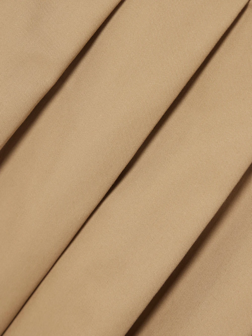 Close-up detail of the Tolu Coker Pleated Topstitched Denim Midi Skirt