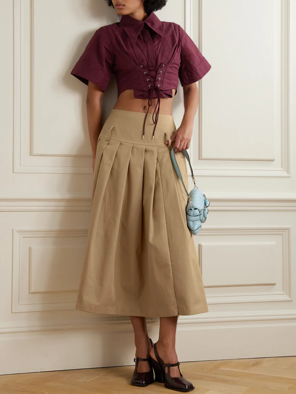 Tolu Coker Pleated Topstitched Denim Midi Skirt, worn by a model
