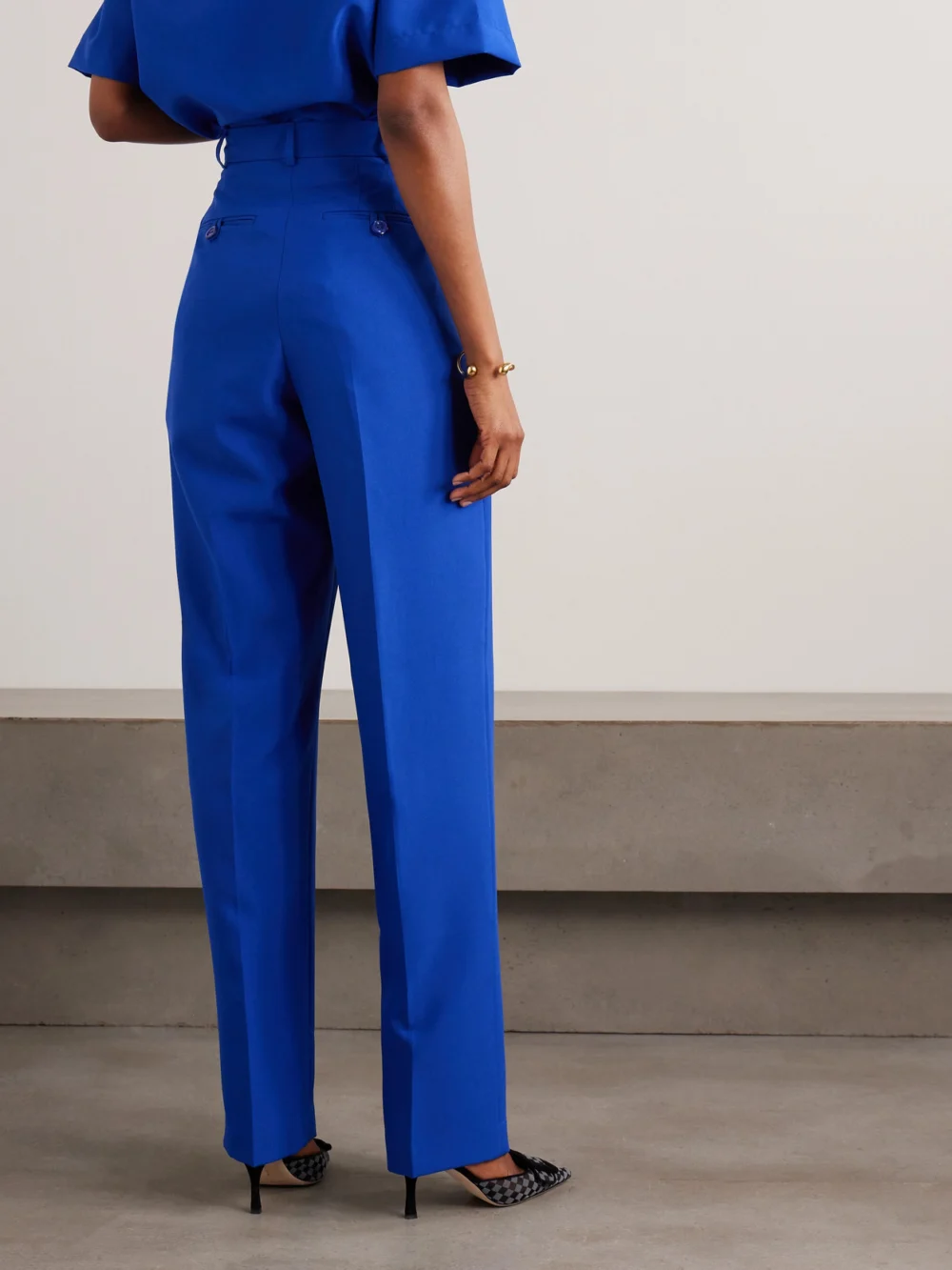 Back view of the Tolu Coker Pleated Twill Straight-leg Pants