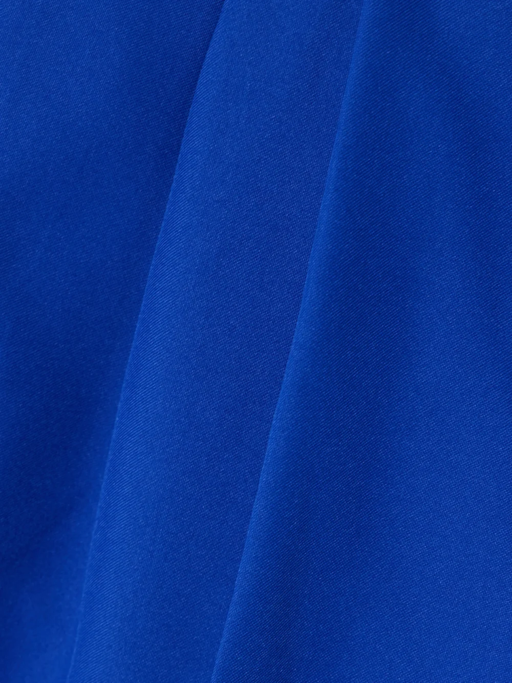 Close-up detail of the Tolu Coker Pleated Twill Straight-leg Pants
