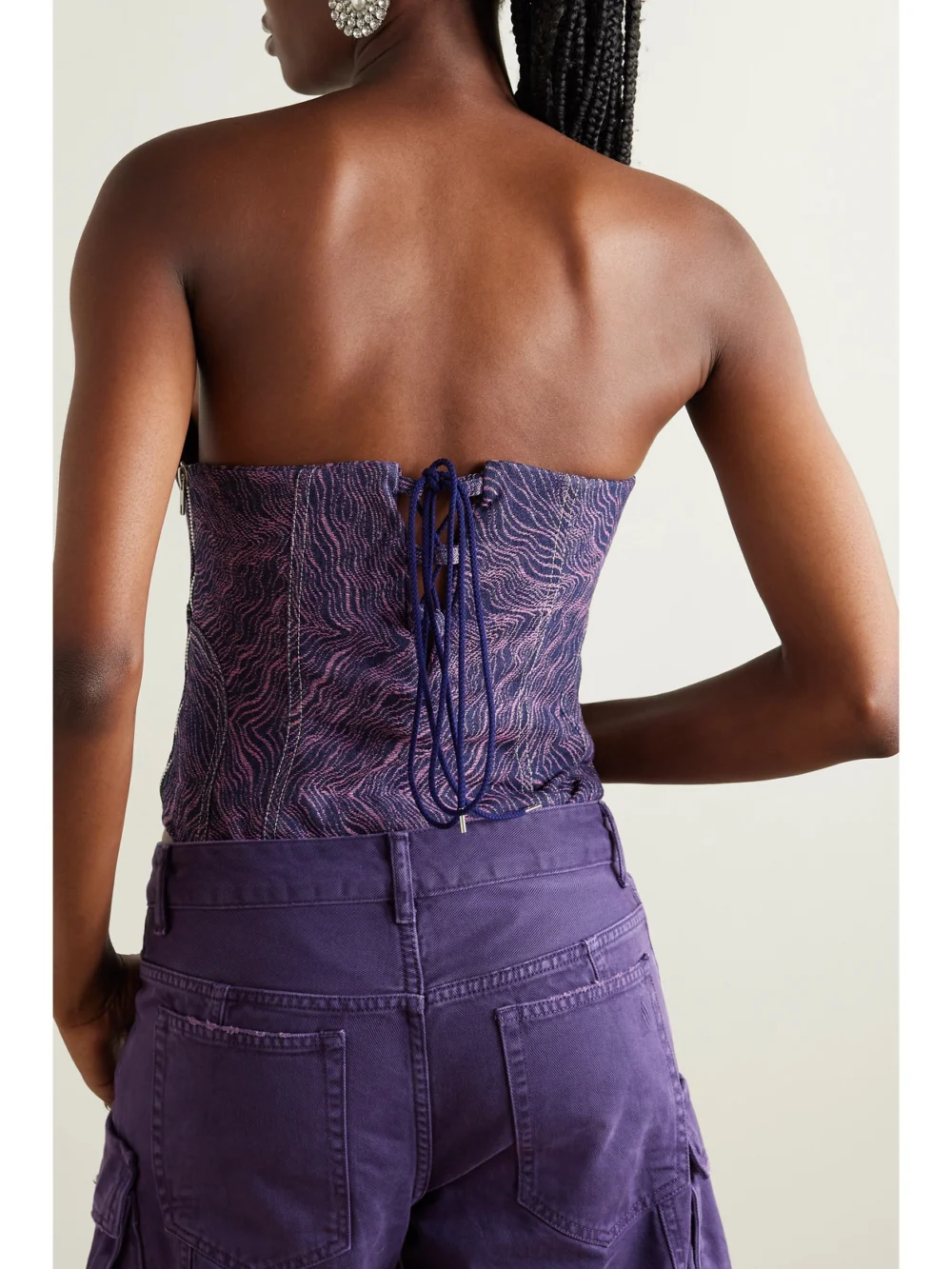 Back view of the Tolu Coker + the Vanguard Strapless Denim-jacquard Bodysuit