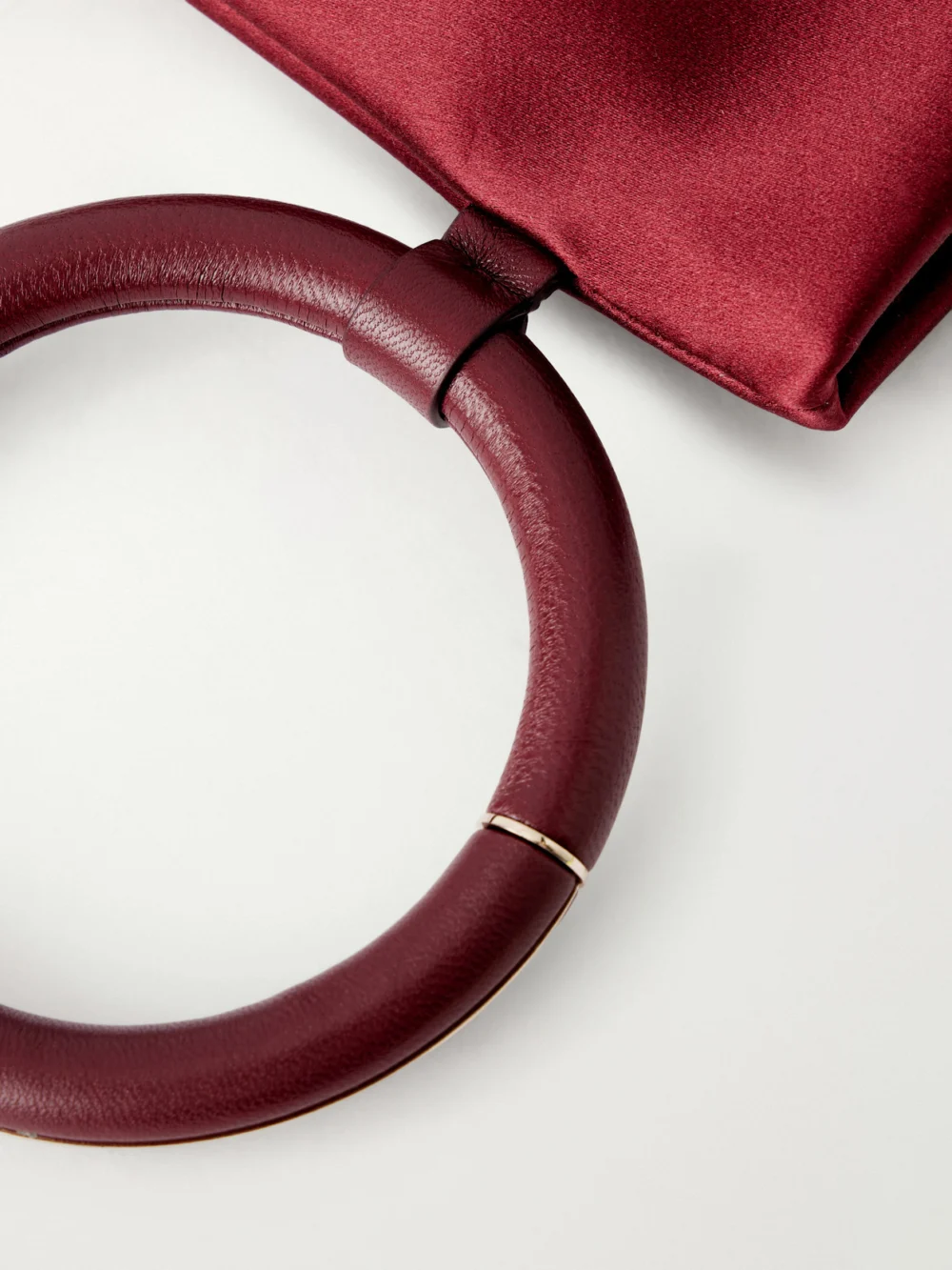 Close-up detail of the Tom Ford Aura Leather-trimmed Satin Clutch