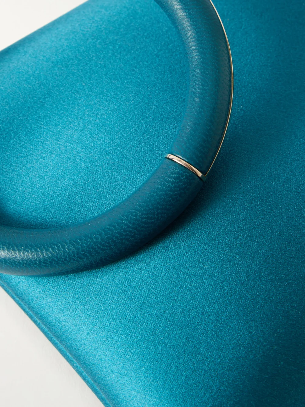 Close-up detail of the Tom Ford Aura Leather-trimmed Satin Clutch