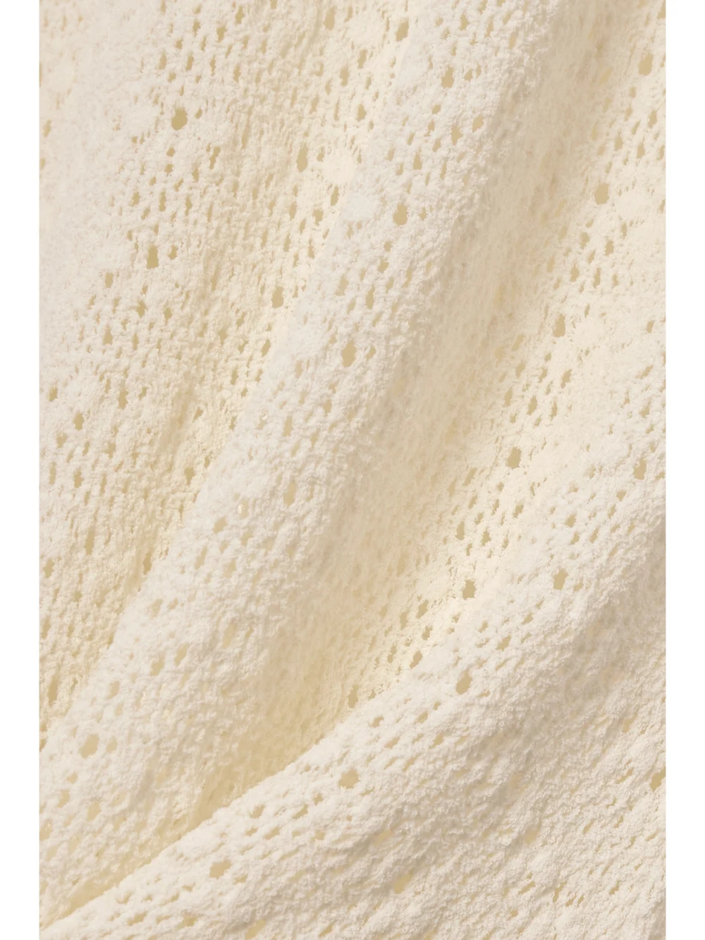 Close-up detail of the Tom Ford Crocheted Turtleneck Gown