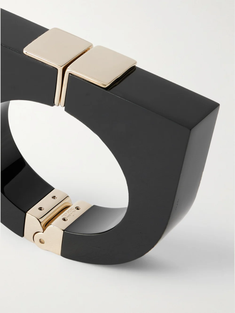Close-up detail of the Tom Ford Gold-tone and Plexiglas® Cuff