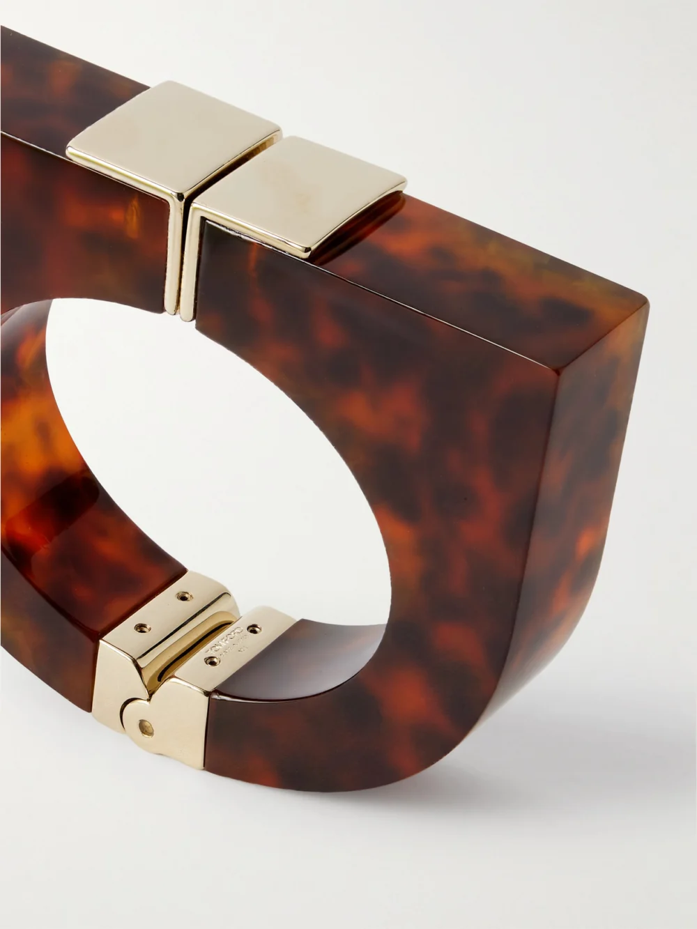 Close-up detail of the Tom Ford Gold-tone and Tortoiseshell Plexiglas® Cuff