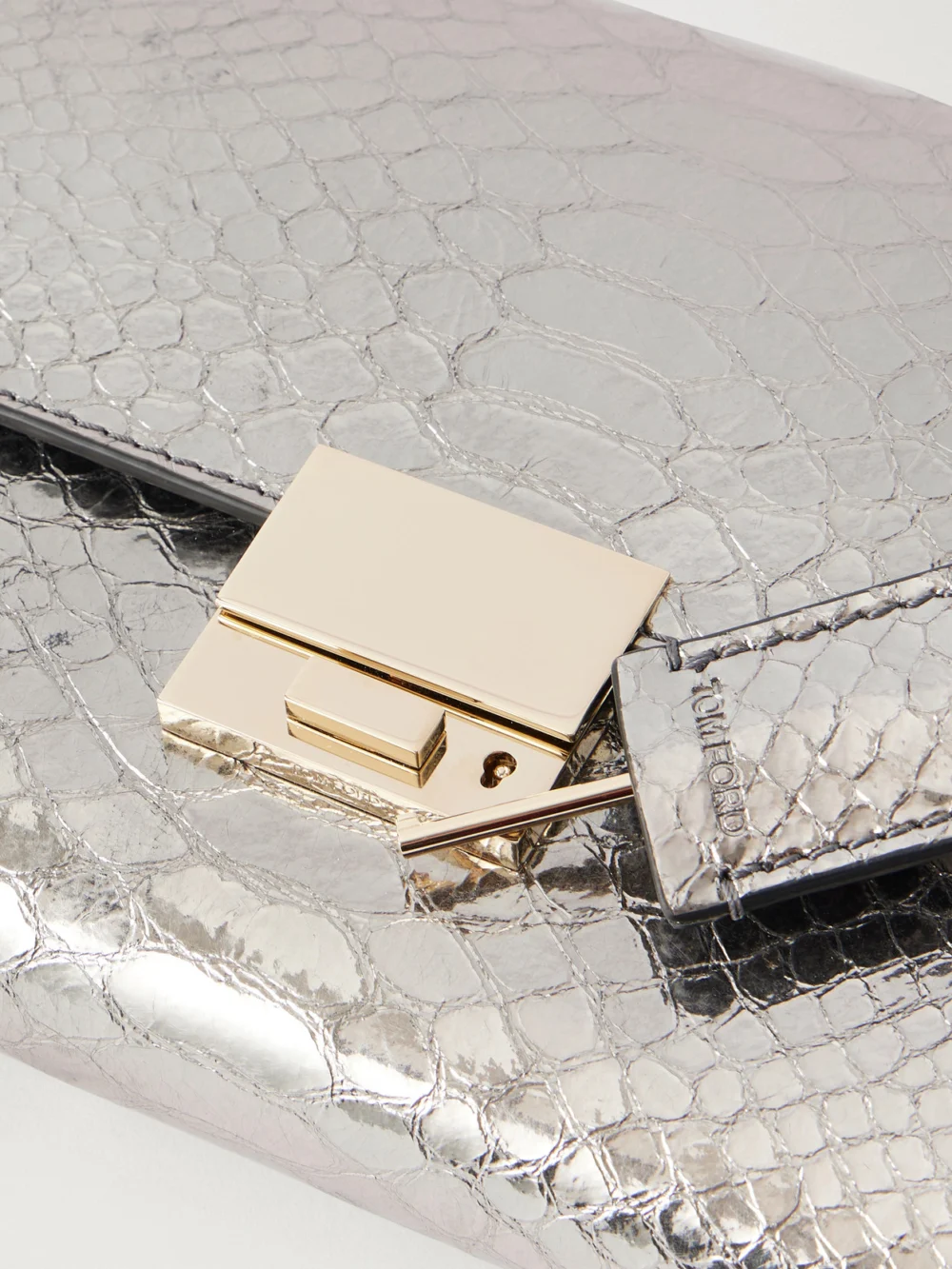 Close-up detail of the Tom Ford Jean Metallic Snake-effect Leather Clutch