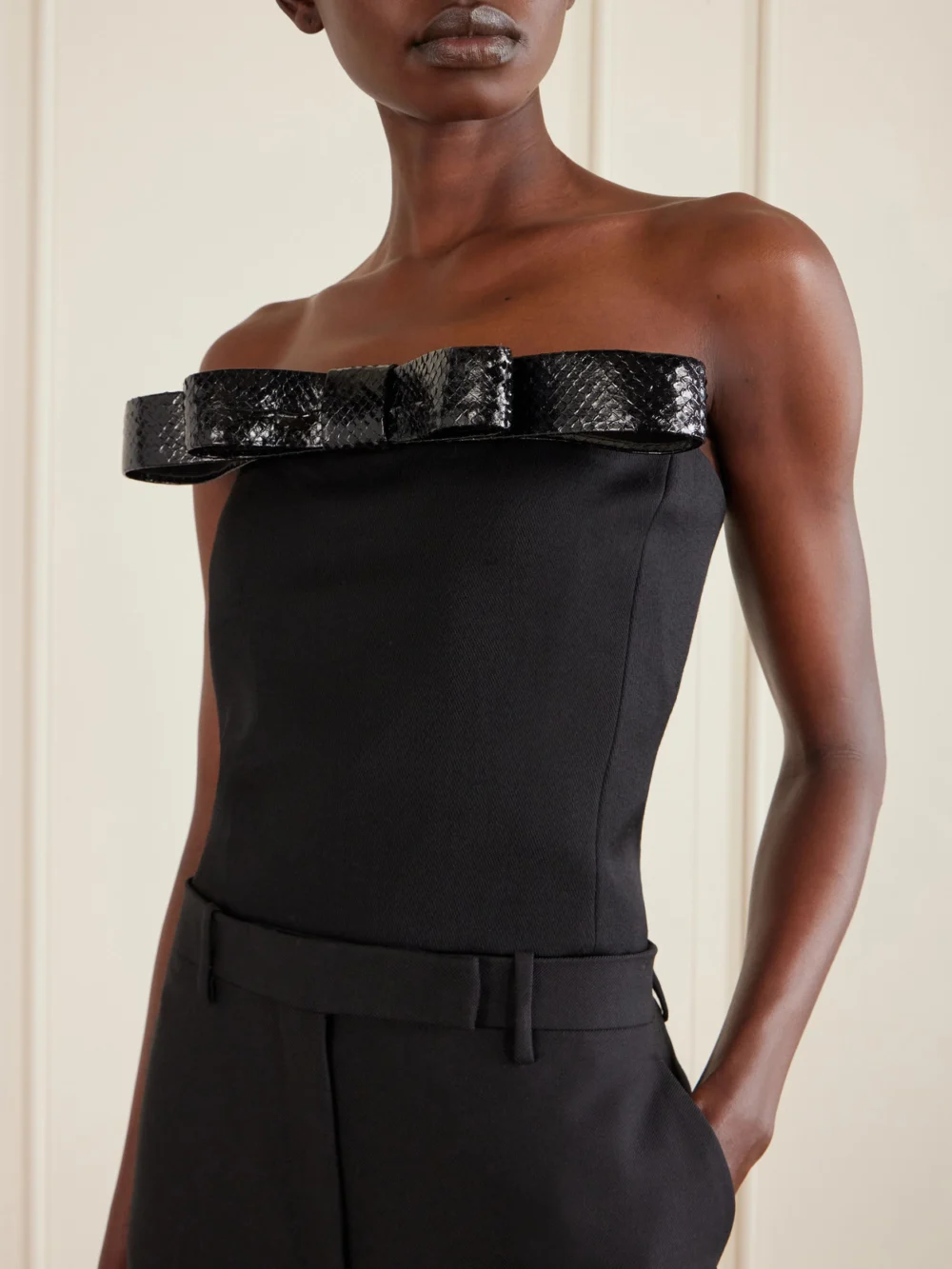 Close-up detail of the Tom Ford Off-the-shoulder Snake-effect Leather-trimmed Wool-twill Top