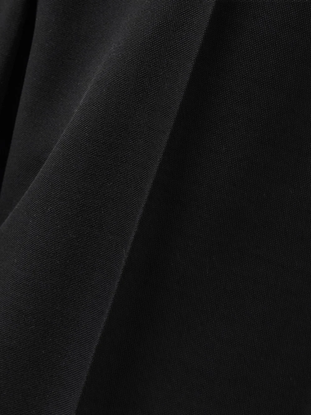 Close-up detail of the Tom Ford Pleated Grain De Poudre Wool Straight-leg Pants
