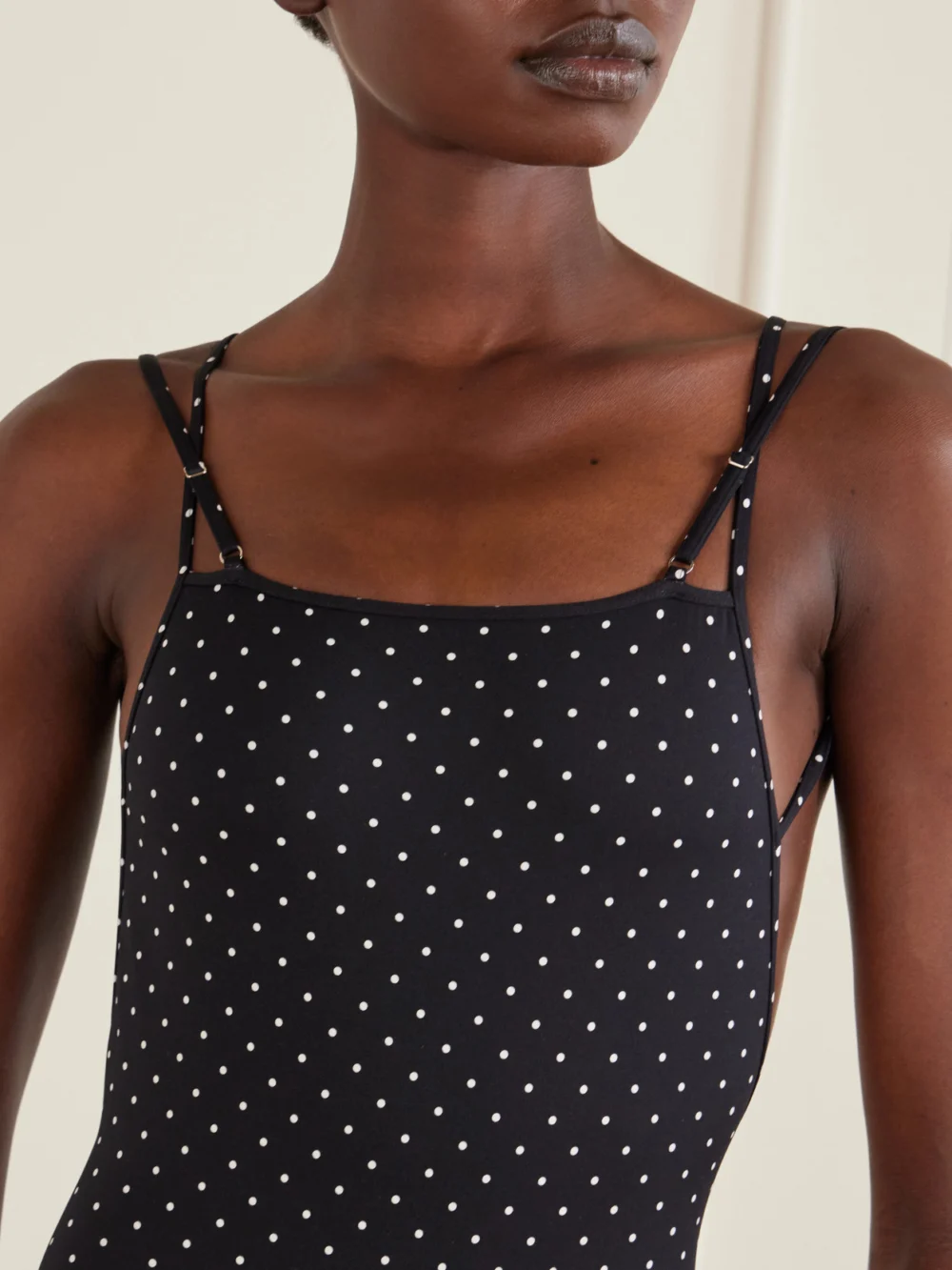 Close-up detail of the Tom Ford Polka Dot Jersey Swimsuit