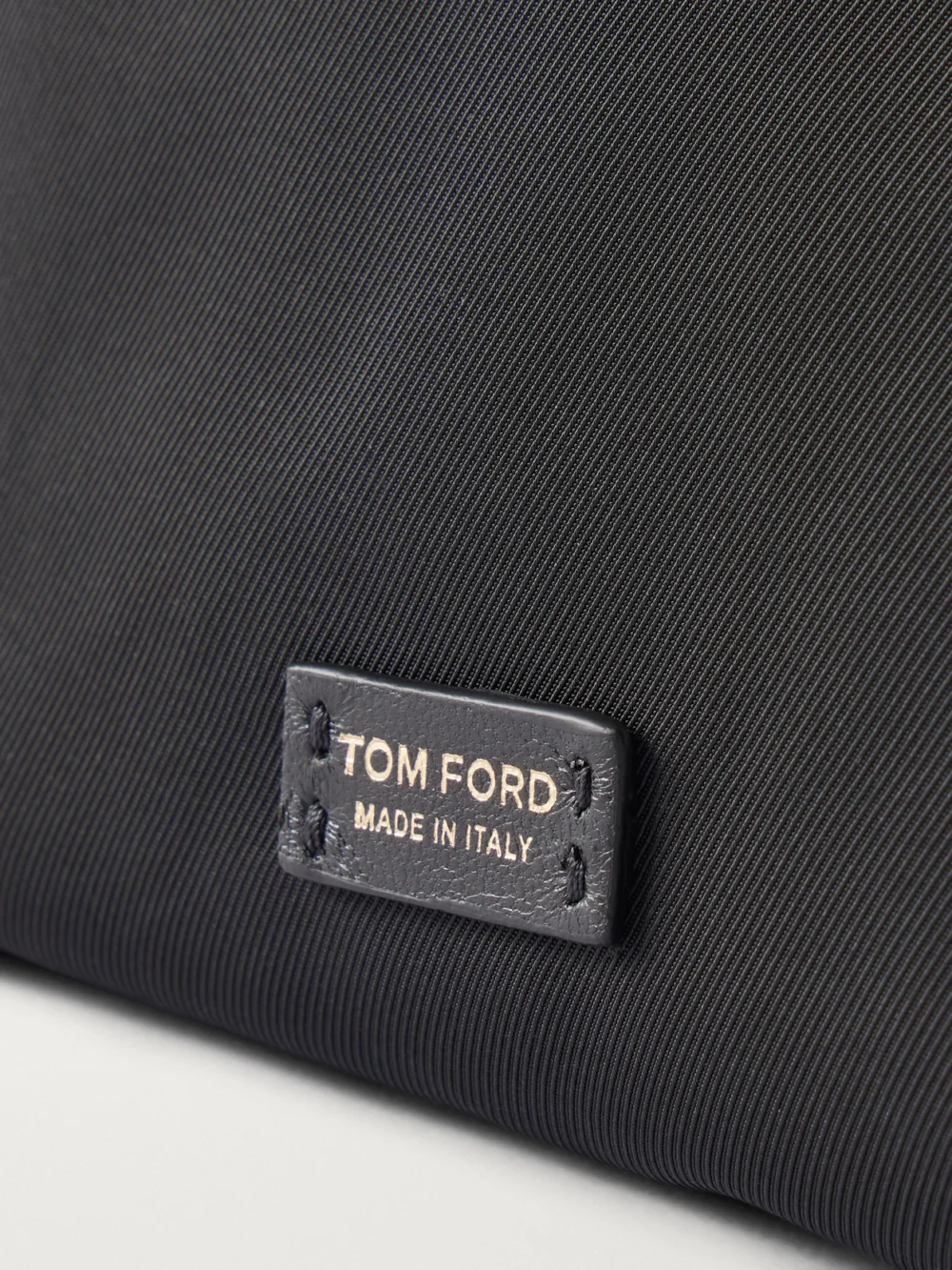 Close-up detail of the Tom Ford Twill Clutch