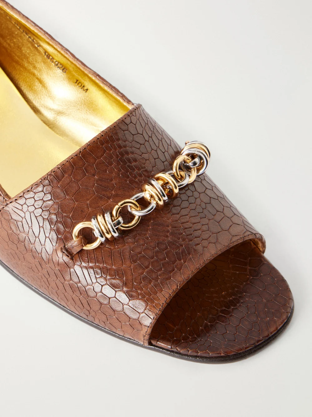 Close-up detail of the Tory Burch Chain-detail Croc-effect Leather Loafers