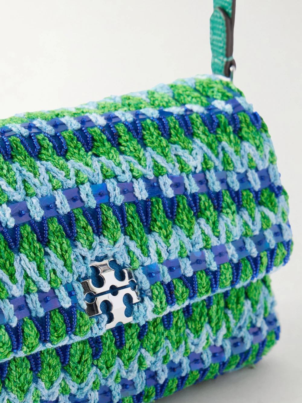 Close-up detail of the Tory Burch Charlie Embellished Snake-effect Leather-trimmed Crocheted Shoulder Bag