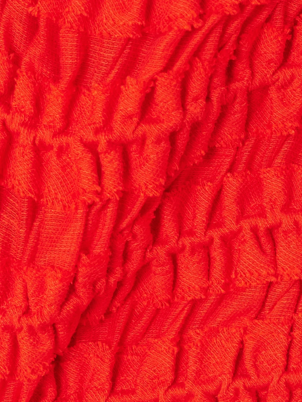 Close-up detail of the Tory Burch Cropped Ruffled Shirred Lyocell-blend Top