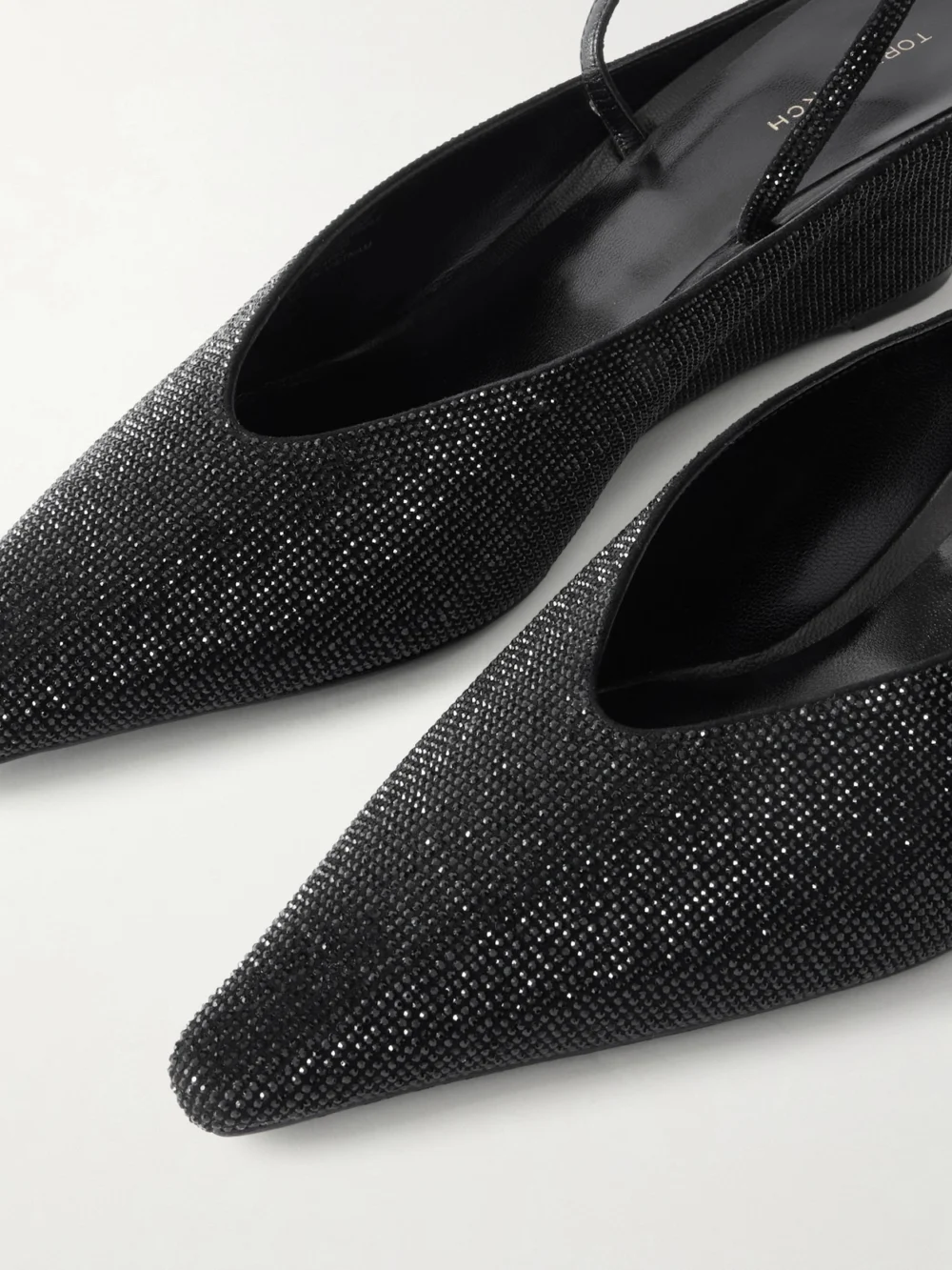 Close-up detail of the Tory Burch Crystal-embellished Leather Wedge Pumps