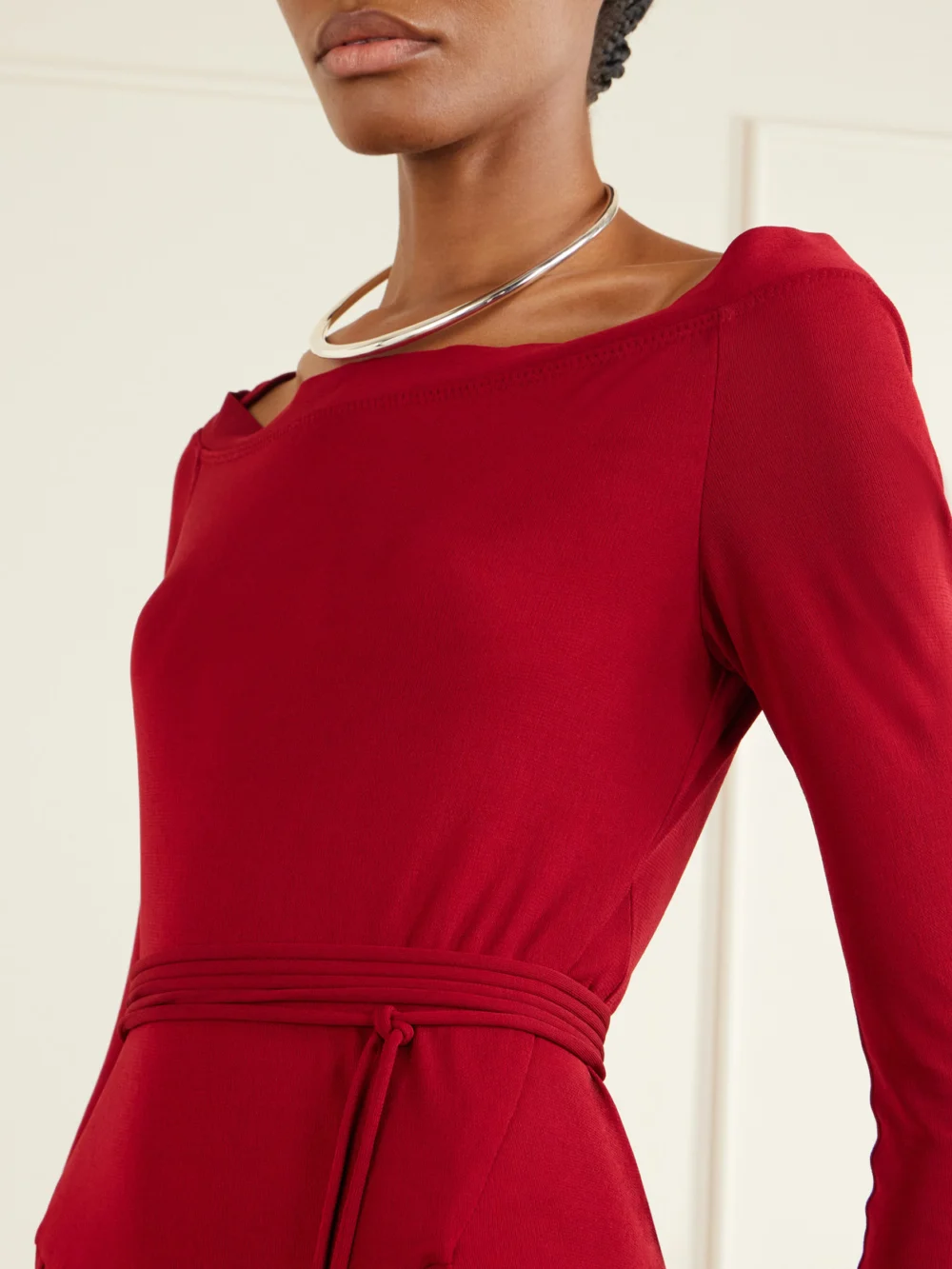Close-up detail of the Tory Burch Jersey Pleated Maxi Dress