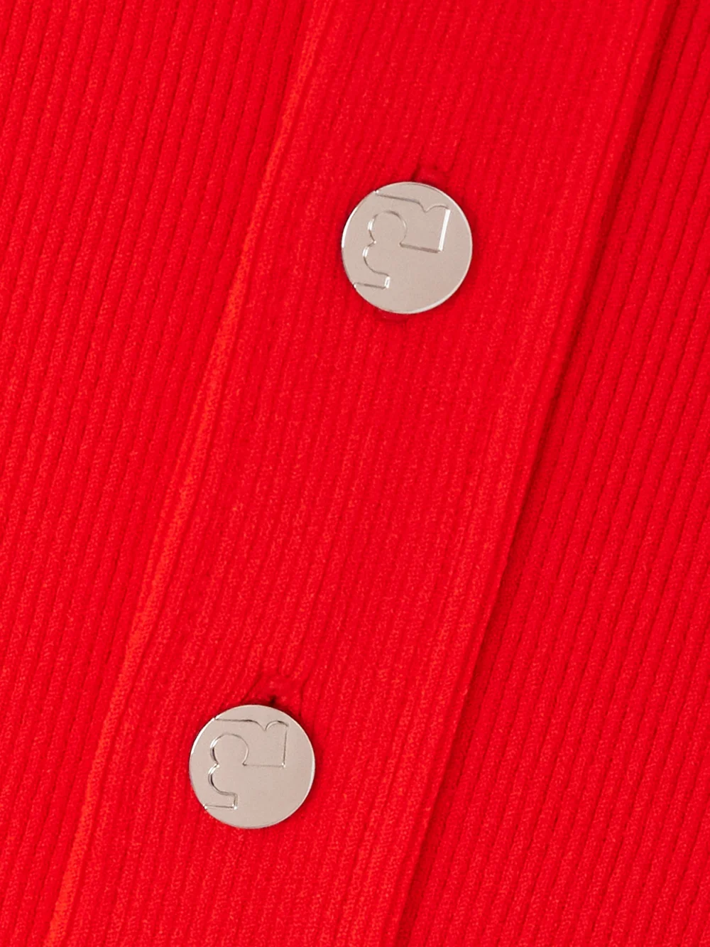 Close-up detail of the Tory Burch Maggie Ribbed-knit Polo Shirt