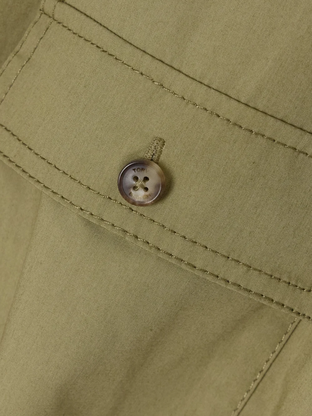 Close-up detail of the Tory Burch Pleated Cotton-blend Poplin Mini Shirt Dress