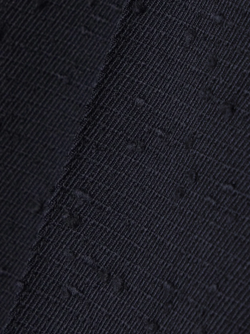 Close-up detail of the Tory Burch Pleated Wool-blend Tapered Pants