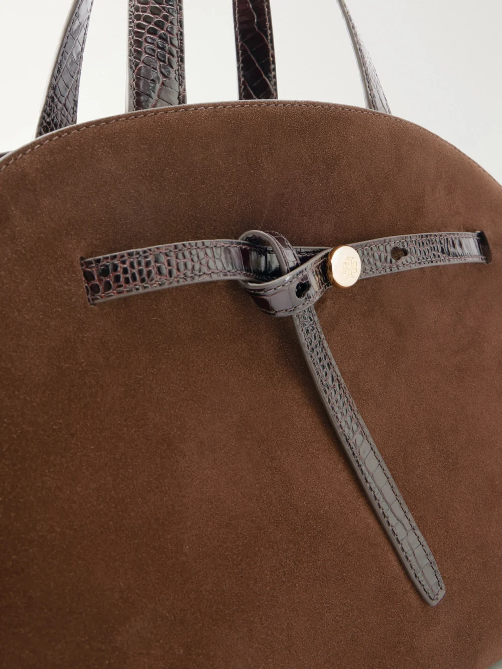 Close-up detail of the Tory Burch Romy Bauletto Leather-trimmed Suede Leather Tote