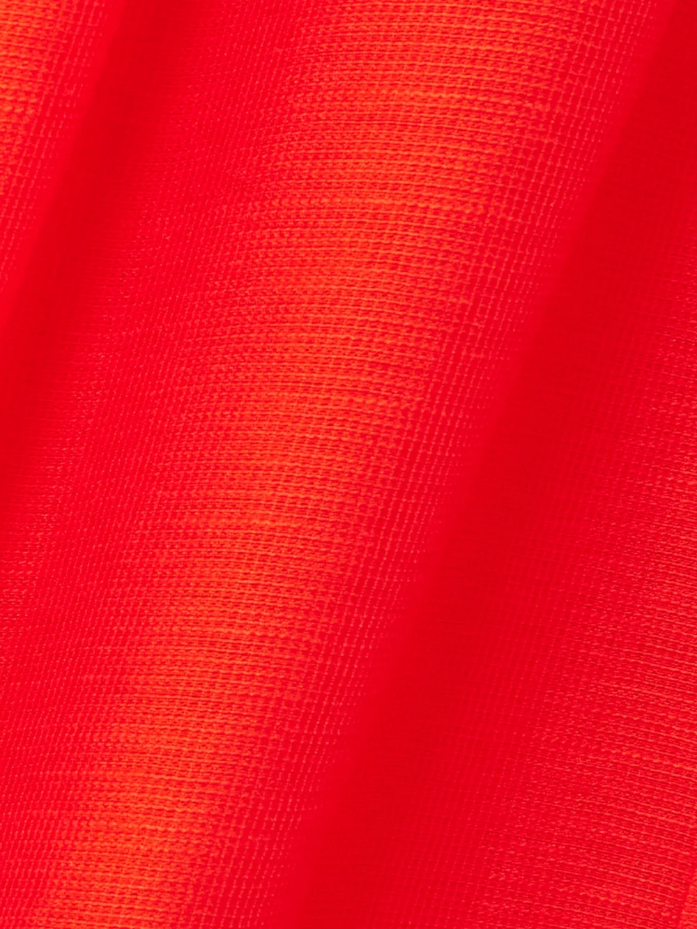 Close-up detail of the Tory Burch Ruffled Shirred Lyocell-blend Midi Skirt