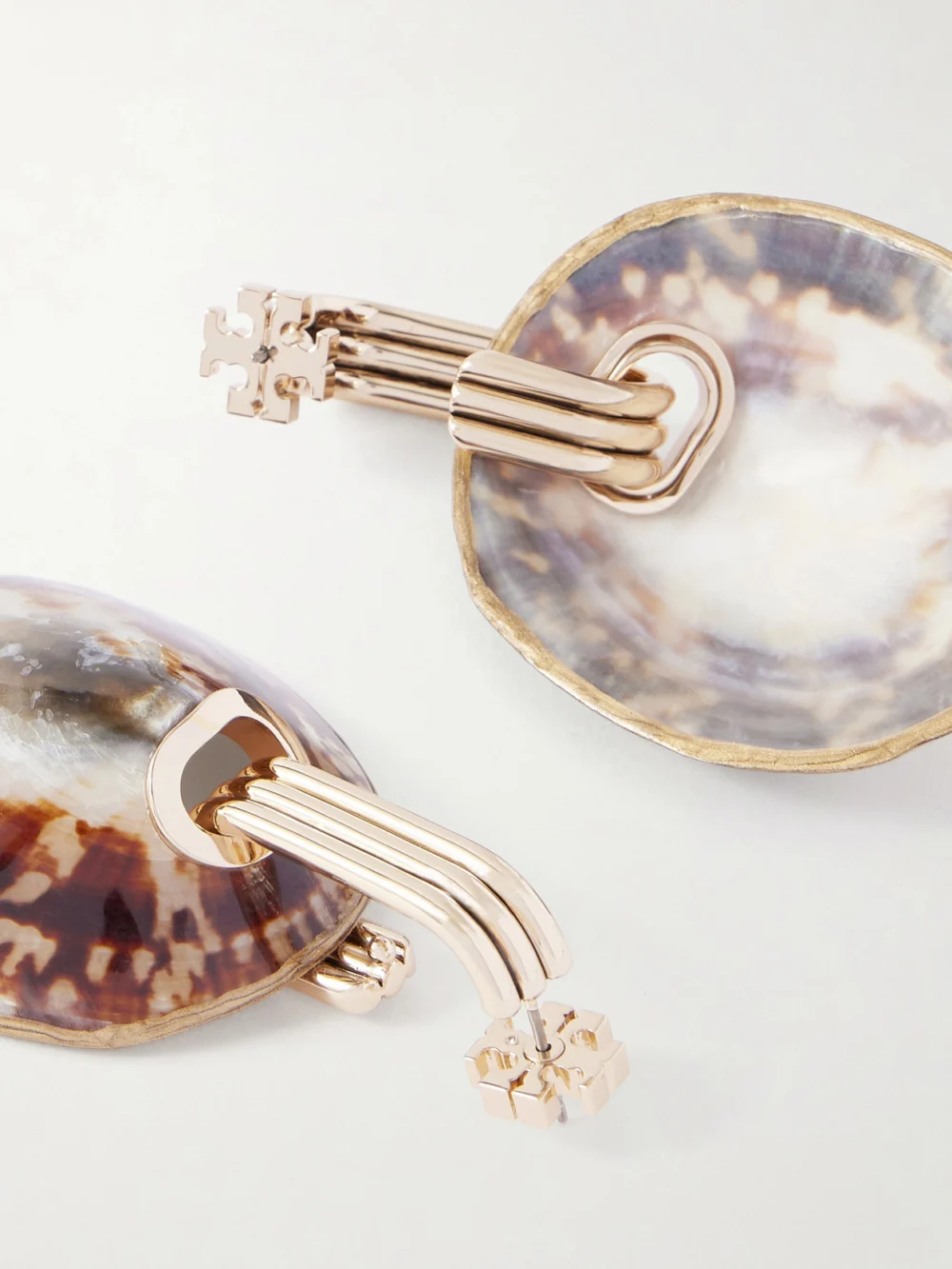 Close-up detail of the Tory Burch Shell Drop Earrings