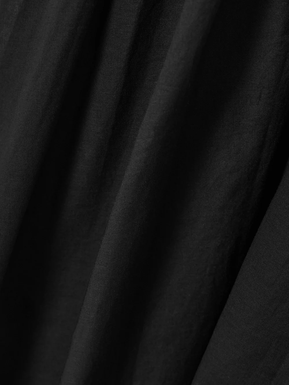Close-up detail of the Tory Burch Smocked Cotton-voile Midi Dress