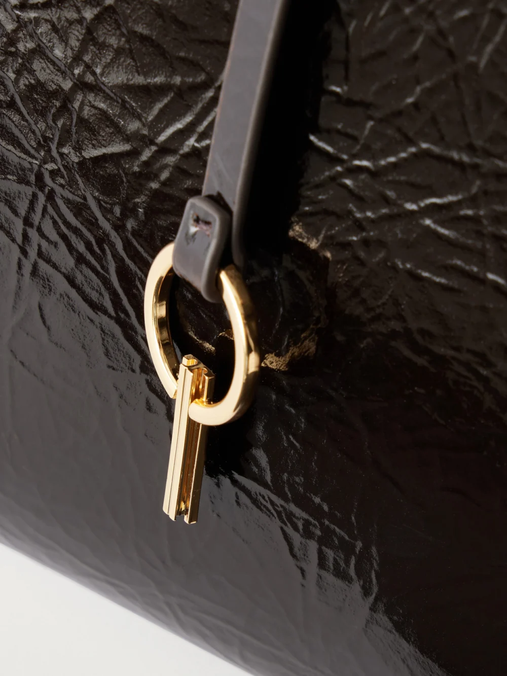 Close-up detail of the Tory Burch Soft Lee Embellished Leather Tote