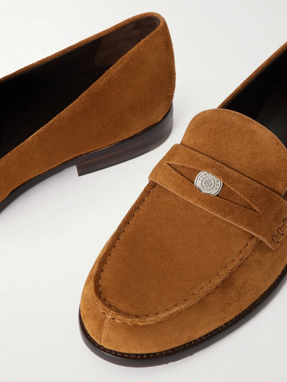 Close-up detail of the Tory Burch Suede Penny Loafers