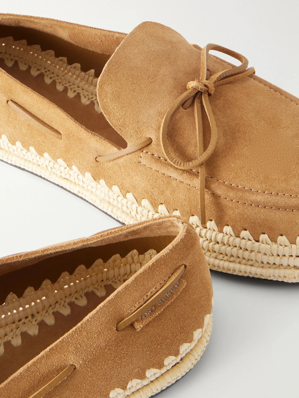 Close-up detail of the Tory Burch The Raffia Boaty Bow-detail Raffia-trimmed Suede Loafers