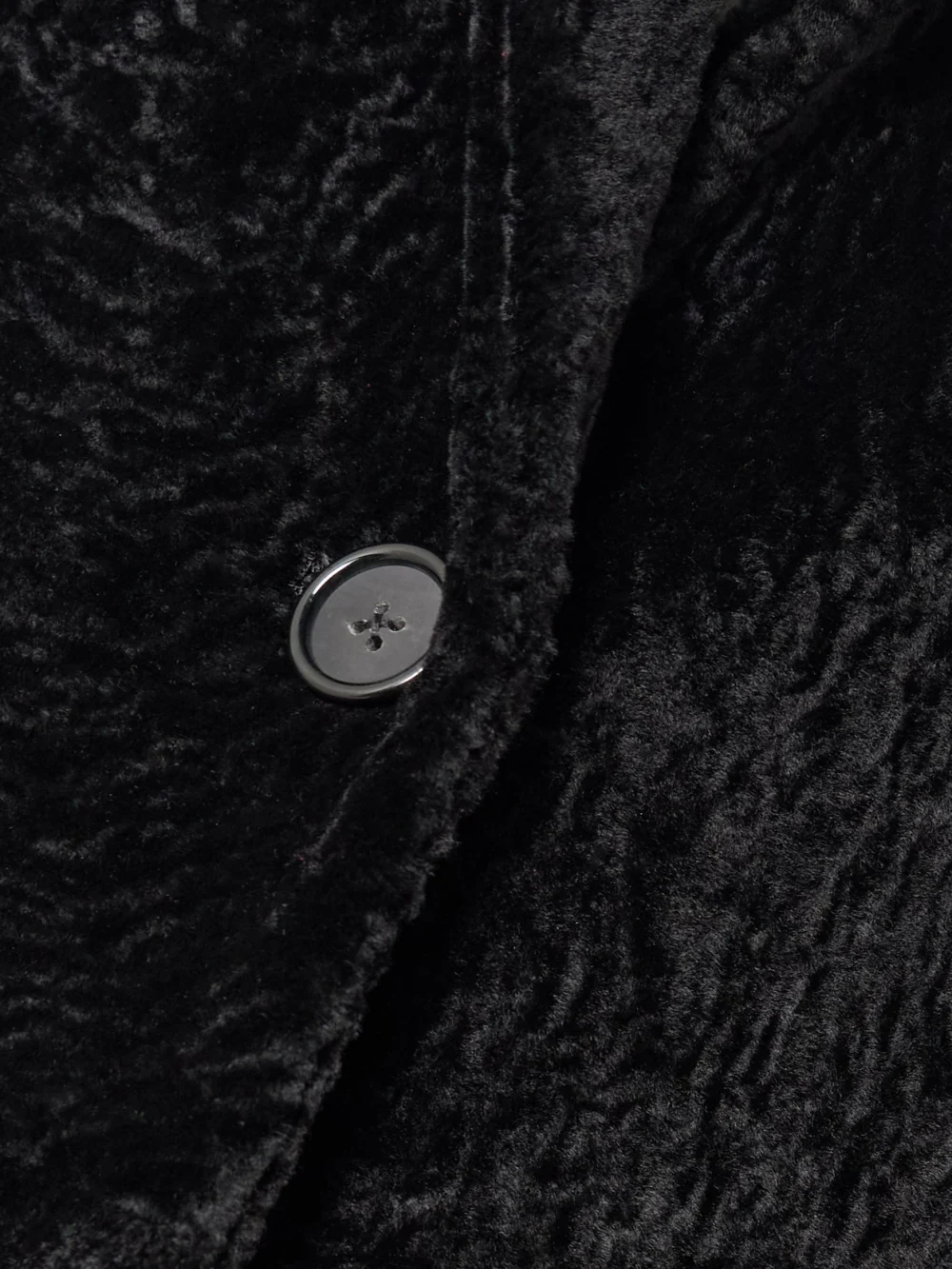 Close-up detail of the Totême Classic Shearling Coat