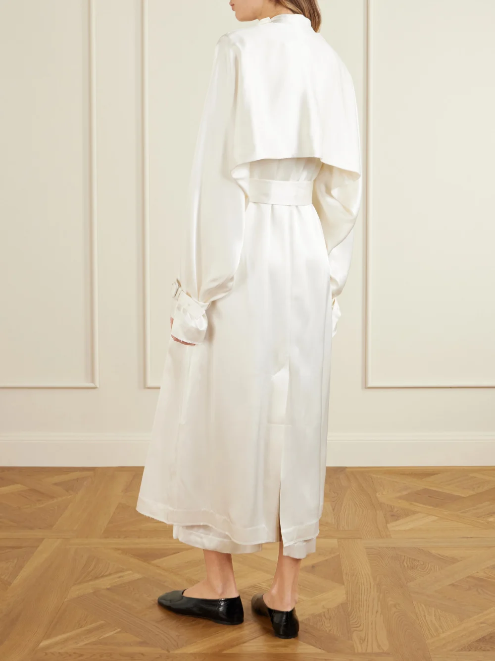 Back view of the Totême Double-breasted Draped Satin Trench Coat