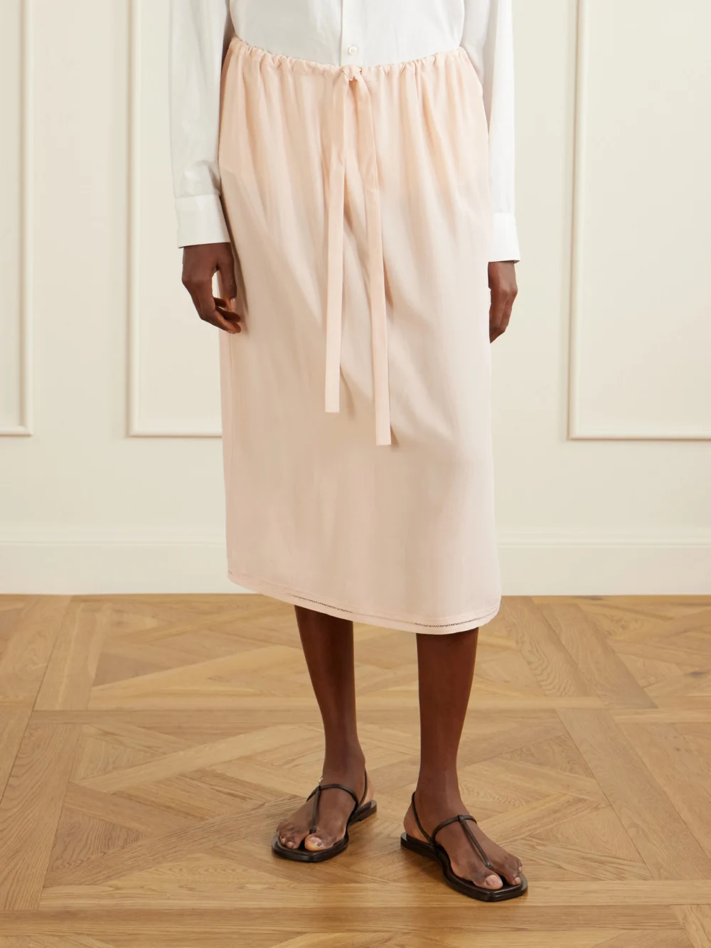 Side view of the Totême Silk Midi Skirt