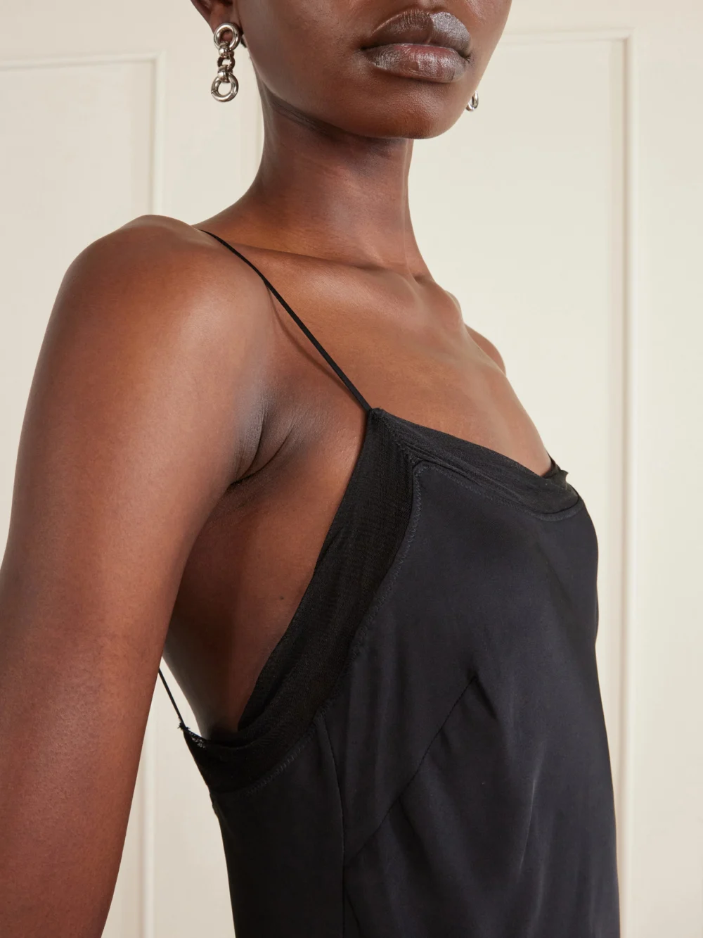 Close-up detail of the Totême Silk-satin Slip Dress