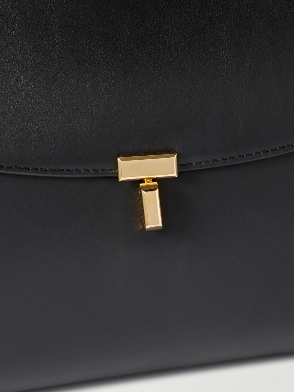Close-up detail of the Totême T-lock Large Leather Shoulder Bag