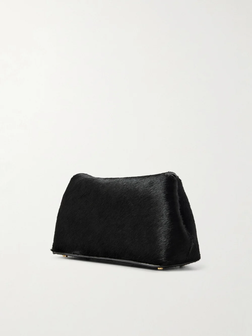 Back view of the Totême T-lock Mini Calf Hair Clutch