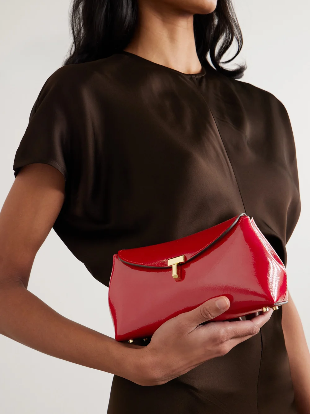 Totême T-lock Mini Patent-leather Clutch, styled view