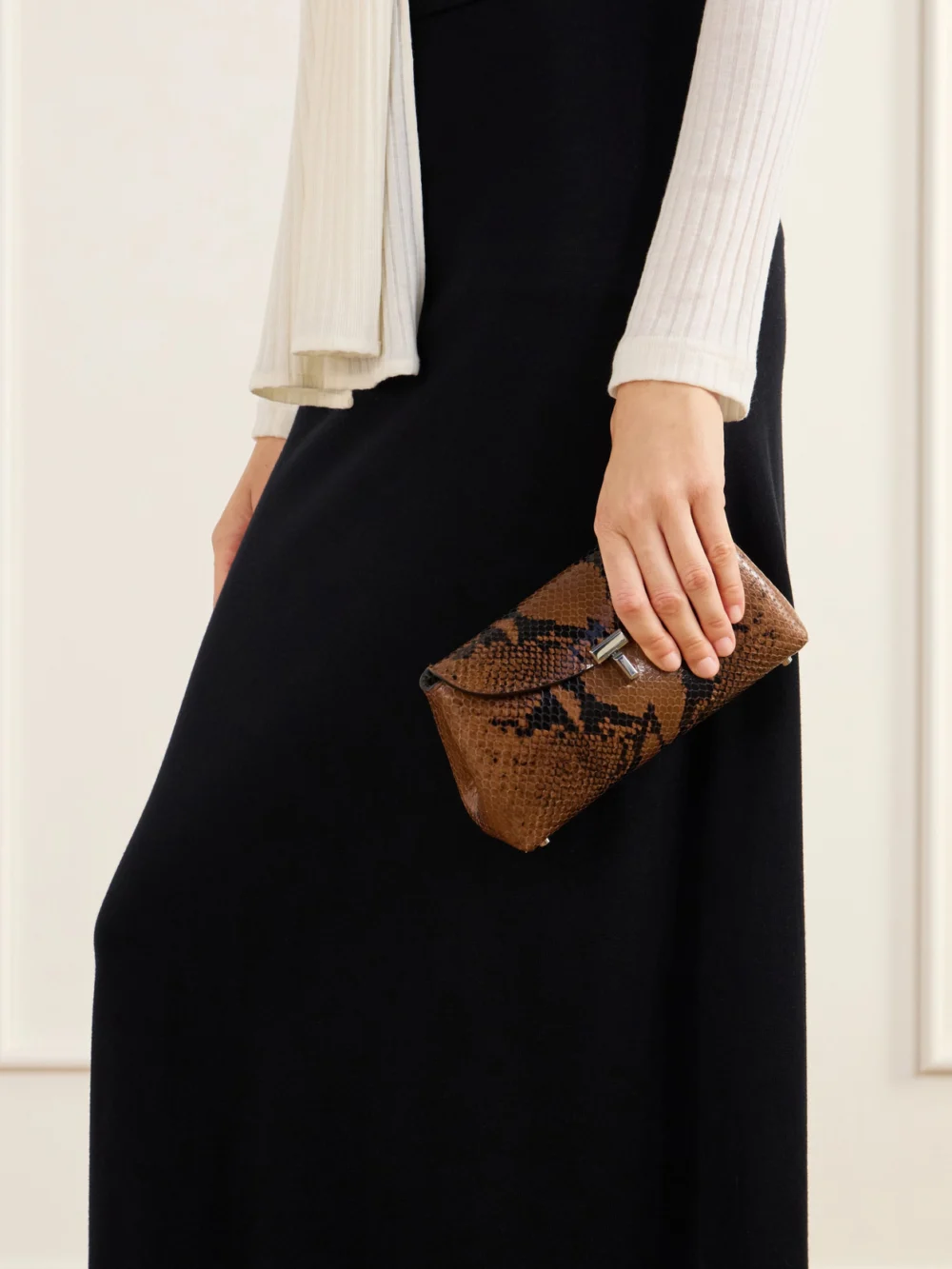 Totême T-lock Mini Snake-effect Leather Clutch, styled view