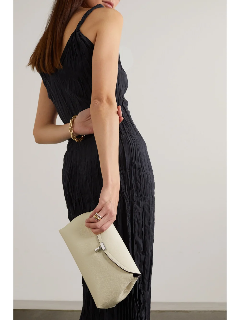 Totême T-lock Textured-leather Clutch, styled view