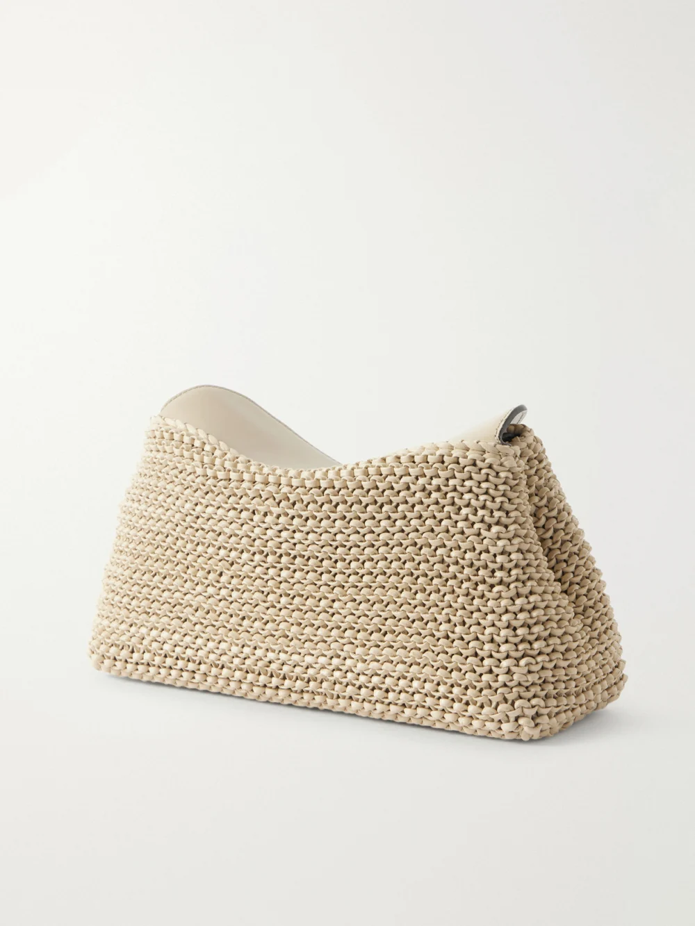 Back view of the Totême T-lock Woven Leather Clutch