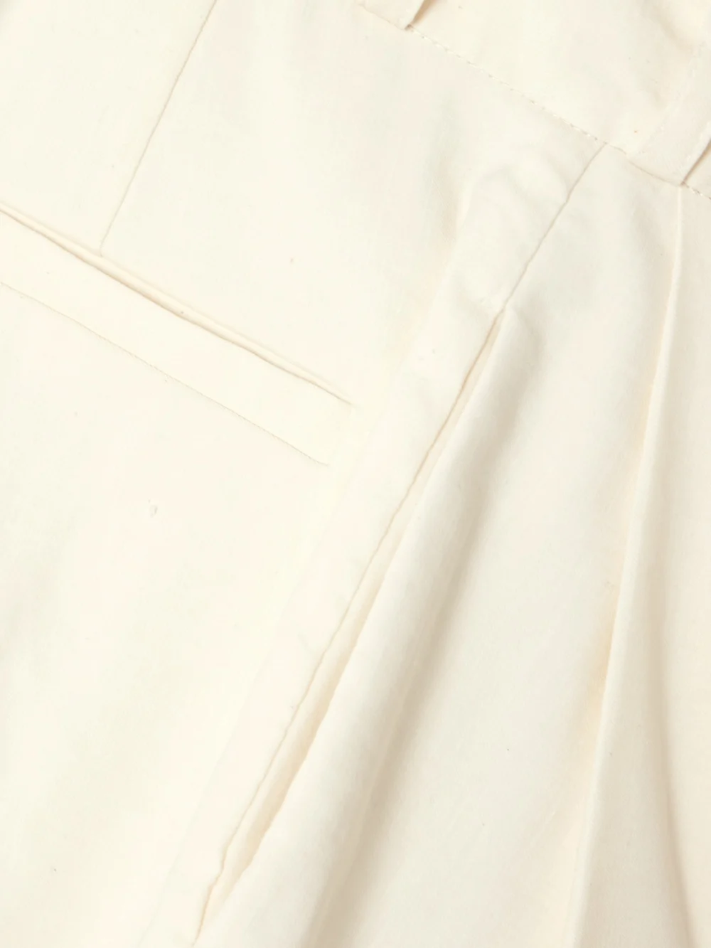 Close-up detail of the Tove Bella Pleated Linen-blend Shorts