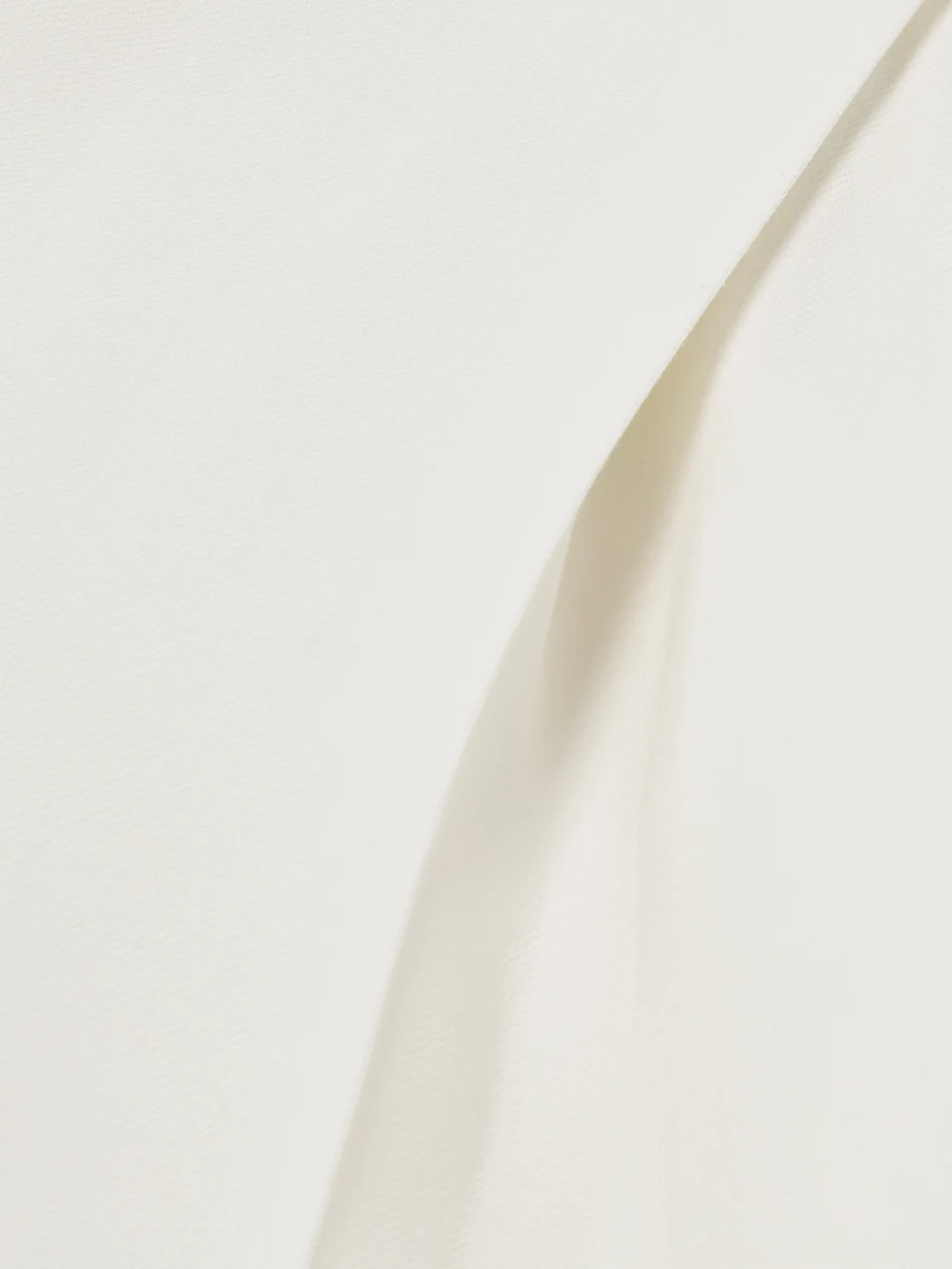 Close-up detail of the Tove Emery Pleated Crepe Straight-leg Pants