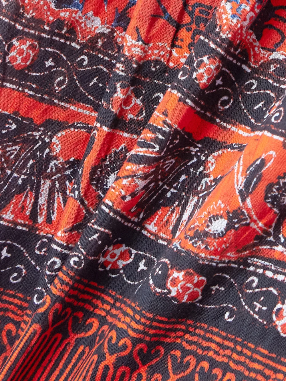 Close-up detail of the Ulla Johnson Abri Belted Tiered Printed Cotton-blend Voile Mini Dress