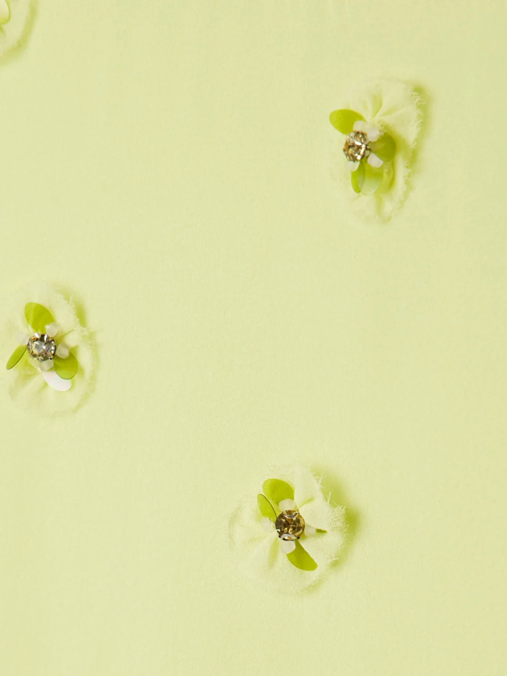 Close-up detail of the Ulla Johnson Eleni Belted Embellished Silk-georgette Maxi Dress