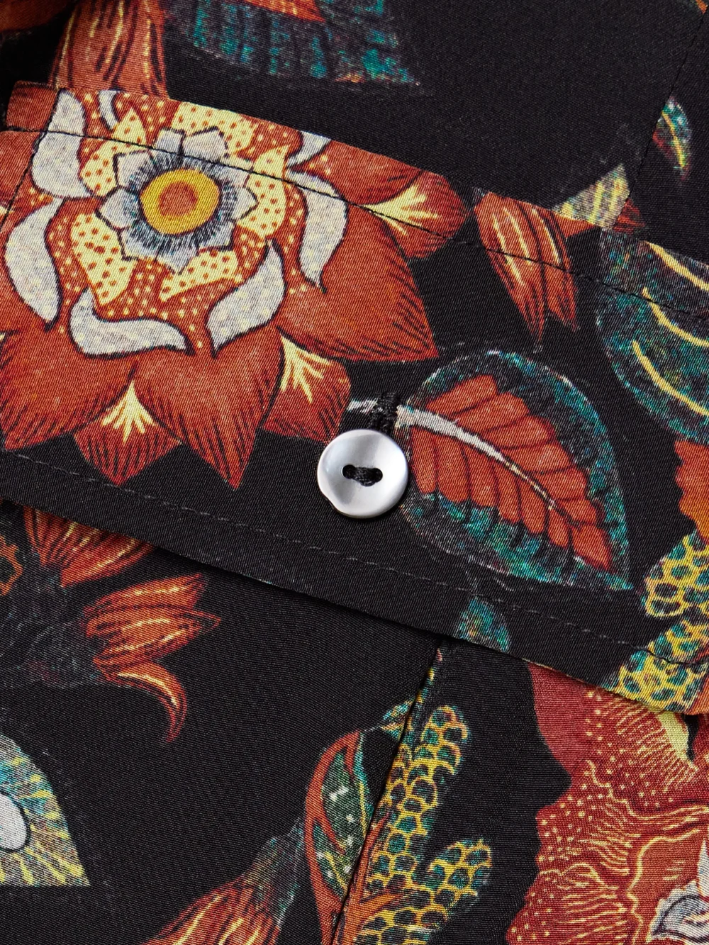 Close-up detail of the Ulla Johnson Giselle Belted Floral-print Silk Midi Dress