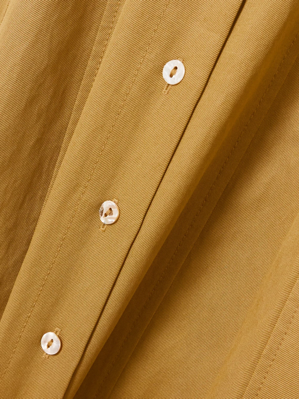 Close-up detail of the Ulla Johnson Vallis Lyocell-blend Twill Midi Shirt Dress